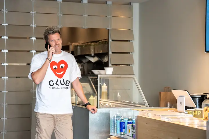 Green Cup co-founder Simon Guest talking on mobile phone